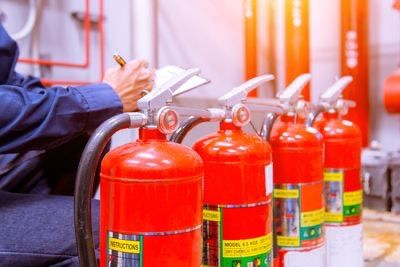 Fire extinguishers prepared for safety inspection