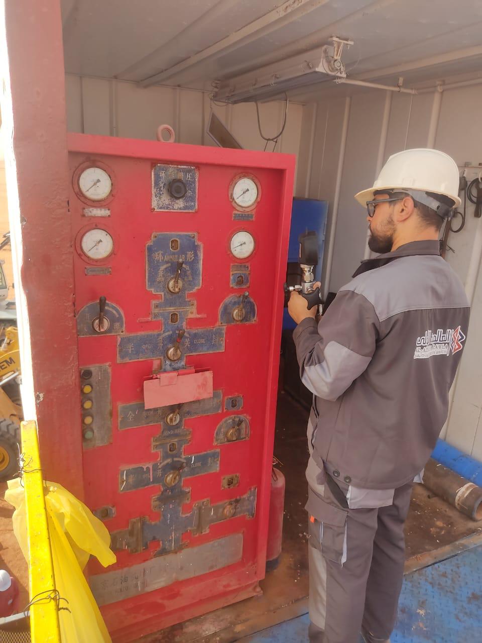 Technician at pressure calibration station