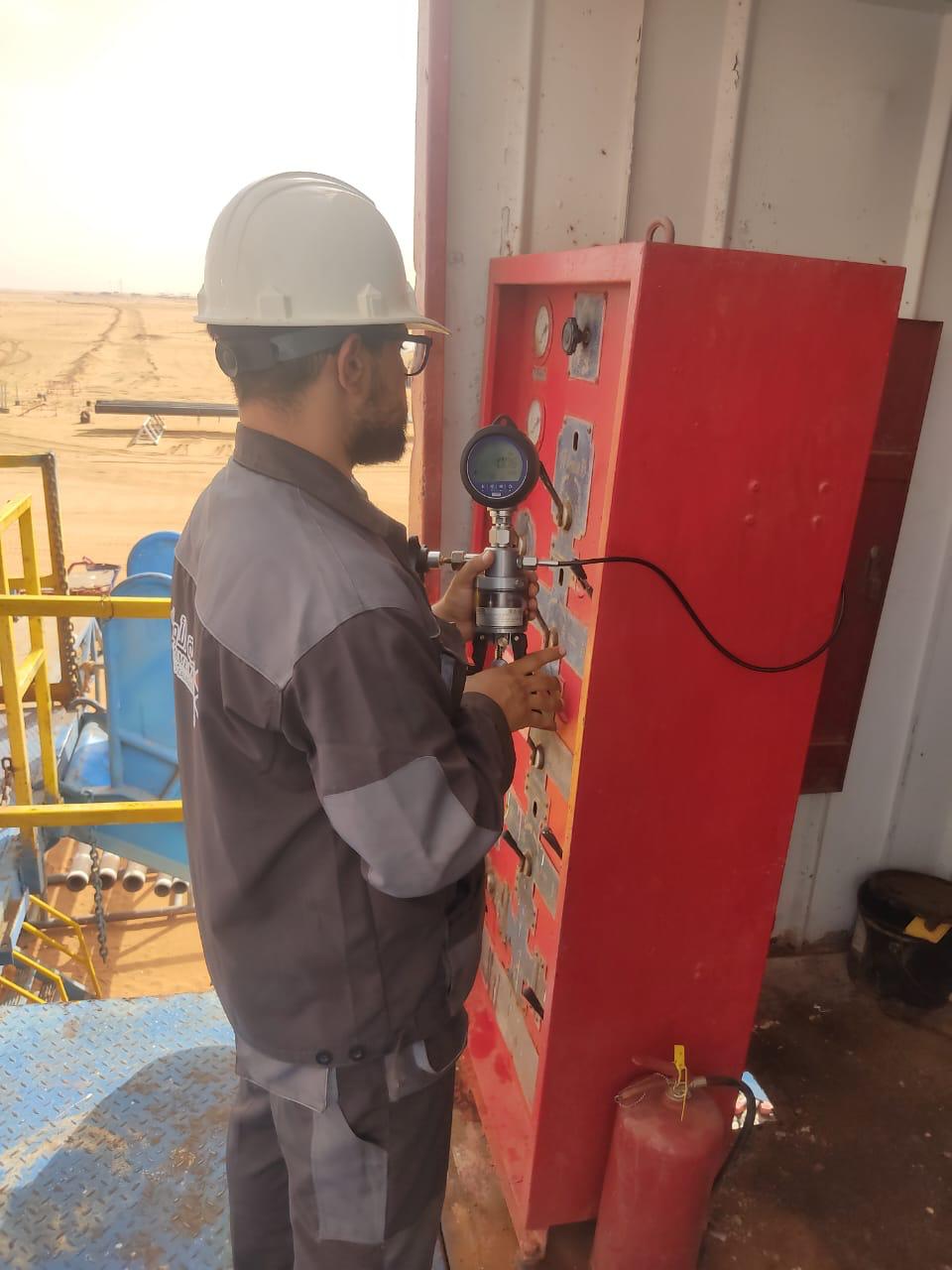 Field technician operating inspection tools